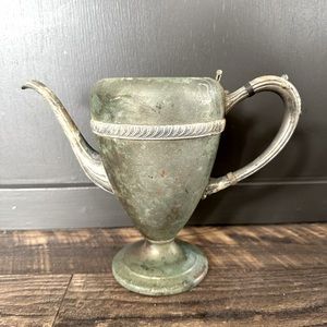 Vintage silver plate over copper coffee pot.